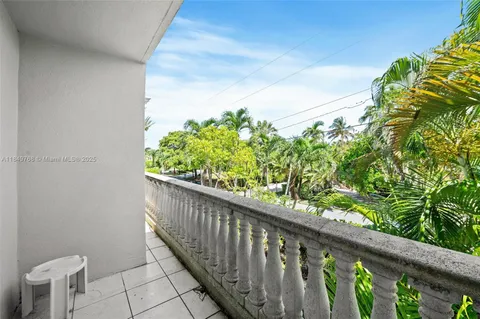 a couple of flower plants in front of door