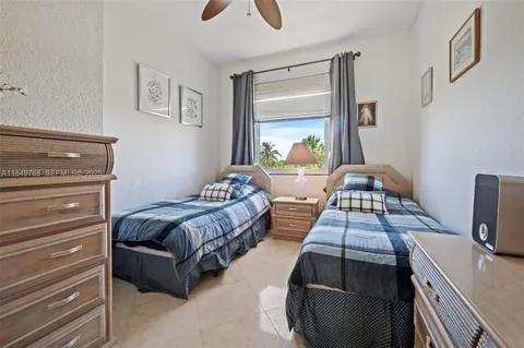 a bedroom with furniture and wooden floor