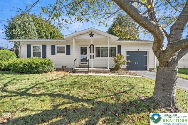 a front view of house with yard