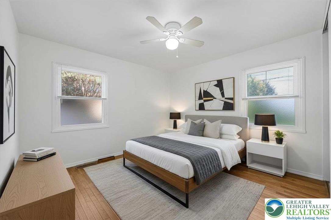 109 South 8th Street Coplay, PA 18037 - Photo 19 of 47 a bedroom with a bed and a chandelier