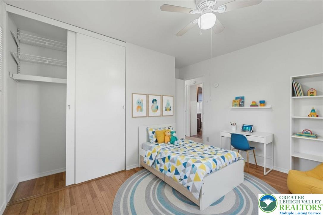 109 South 8th Street Coplay, PA 18037 - Photo 21 of 47 a bedroom with a bed and wooden floor