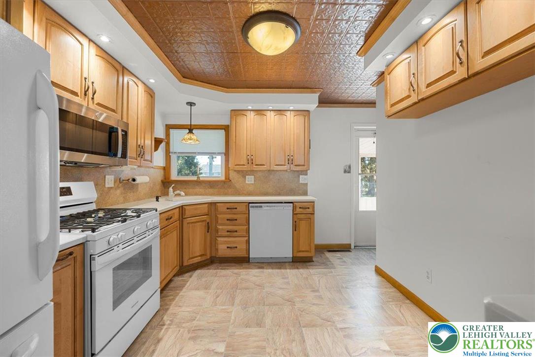 109 South 8th Street Coplay, PA 18037 - Photo 23 of 47 a kitchen with a stove a sink and a refrigerator