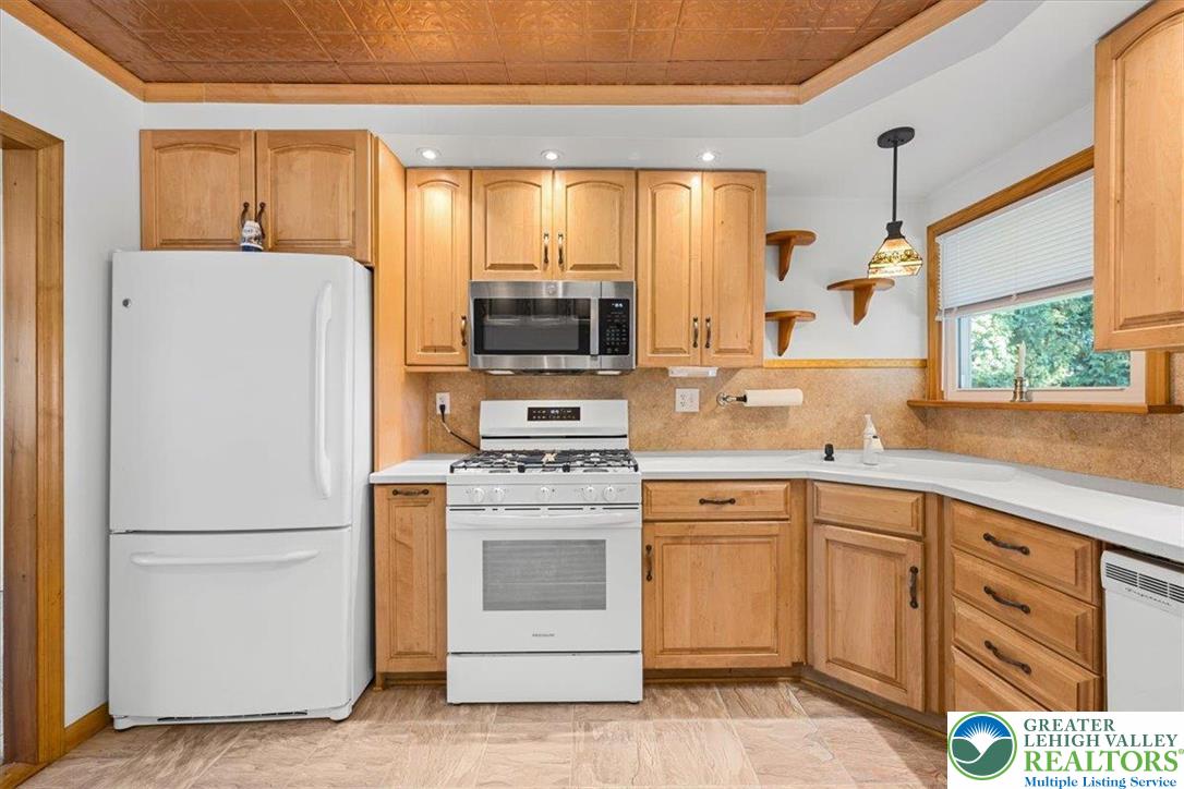 109 South 8th Street Coplay, PA 18037 - Photo 25 of 47 a kitchen with appliances a sink and a window