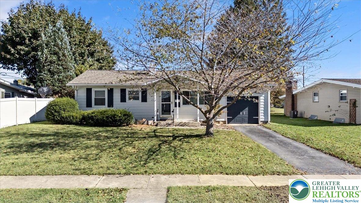 109 South 8th Street Coplay, PA 18037 - Photo 3 of 47 a view of a white house next to a yard with big trees