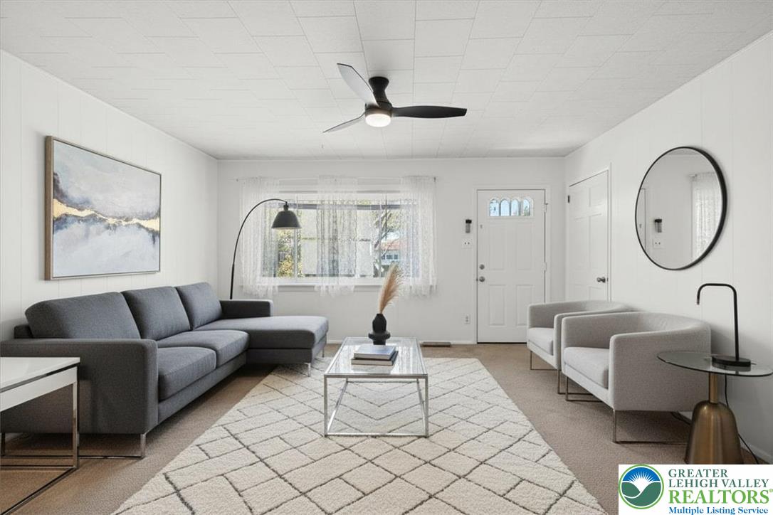 109 South 8th Street Coplay, PA 18037 - Photo 9 of 47 a living room with furniture a table and a large window