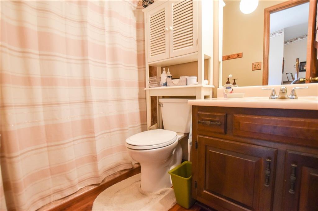 848 North Pike Road Cabot, PA 16023 - Photo 8 of 15 a bathroom with a sink a toilet and shower