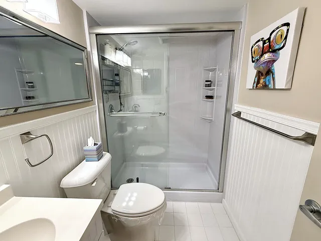 a bedroom with a bed and a walk in closet