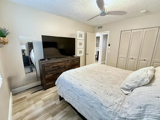 an aerial view of residential houses with outdoor space and river