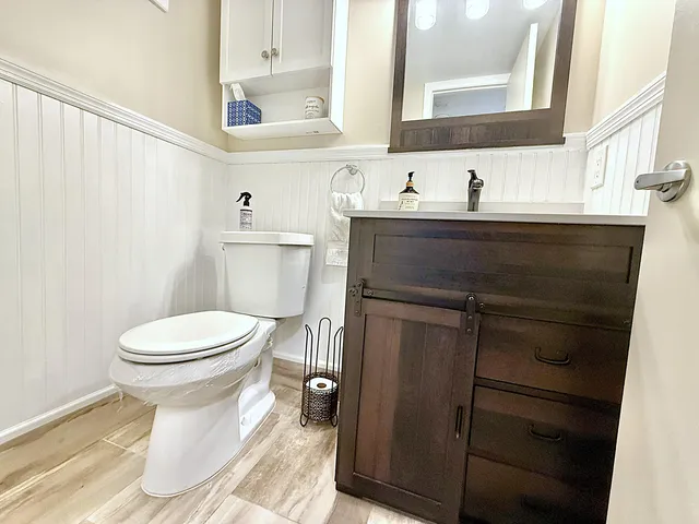 a view of a house with a backyard porch and sitting area