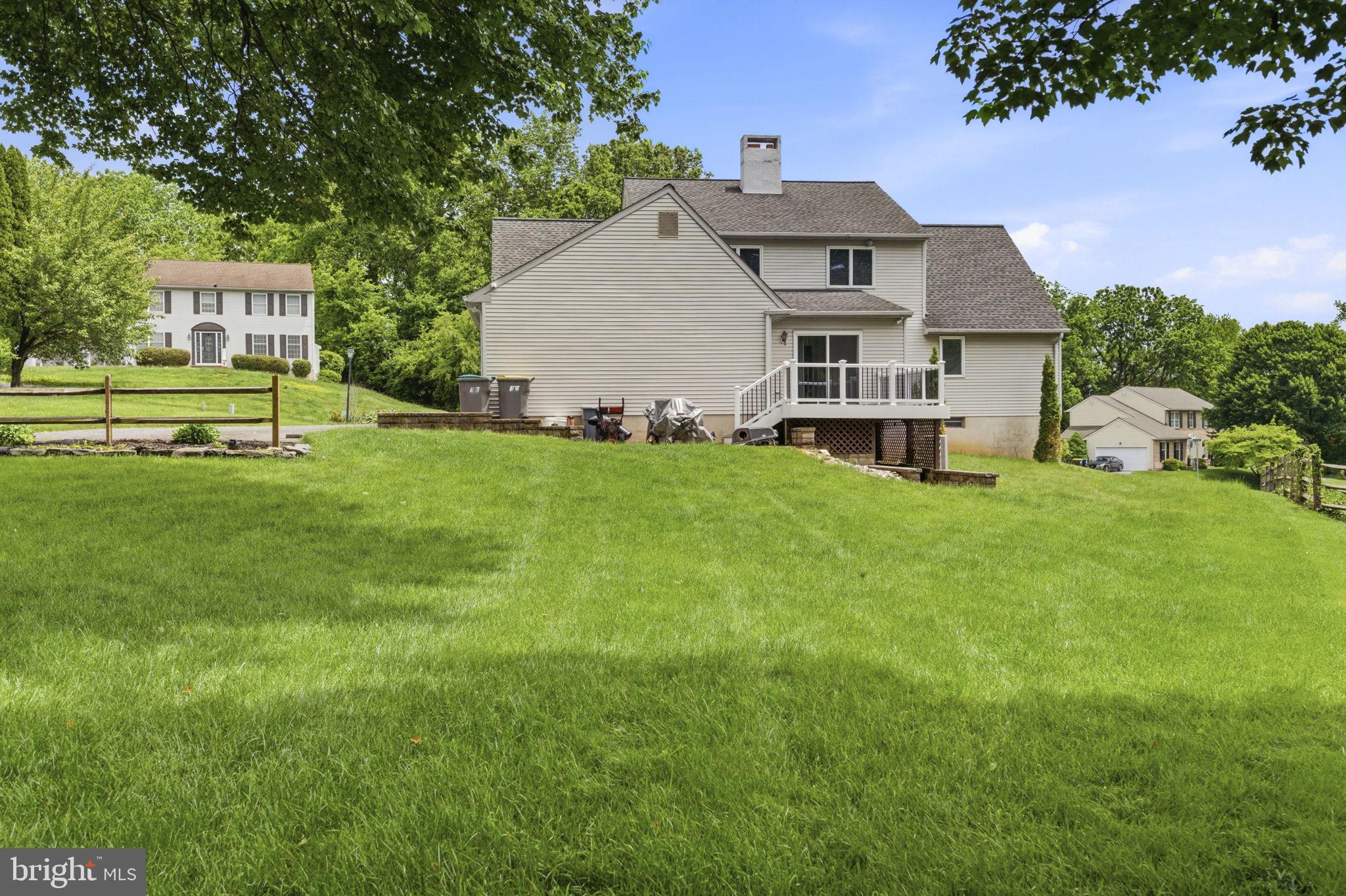 736 Letitia Drive Hockessin, DE 19707 - Photo 76 of 92 a view of a house with a yard and sitting area