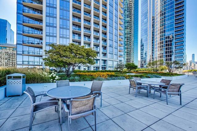 1235 South Prairie Avenue, Unit 706 Chicago, IL 60605 - Photo 13 of 15 a view of a chairs and table in a patio
