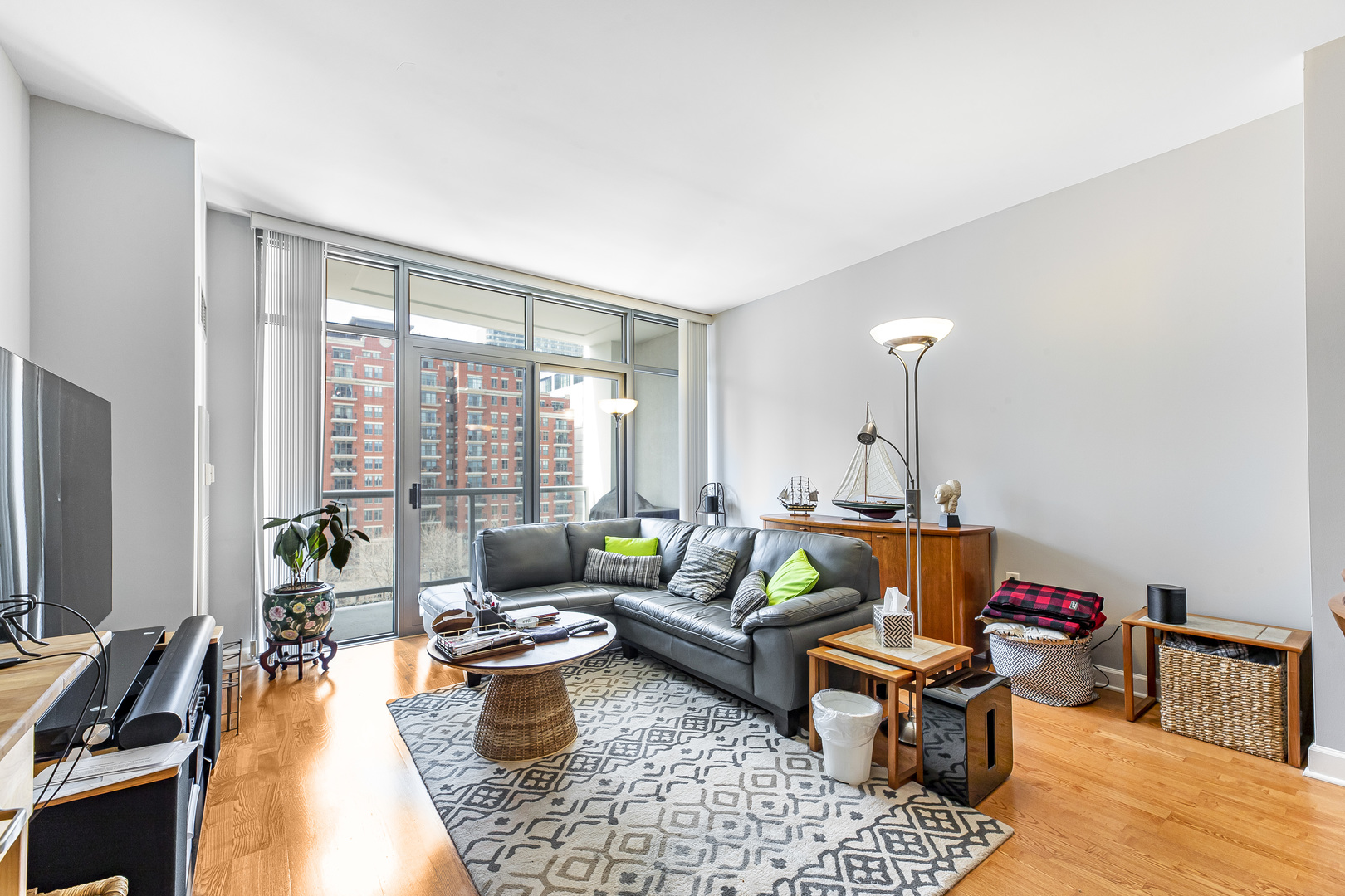 1235 South Prairie Avenue, Unit 706 Chicago, IL 60605 - Photo 2 of 15 a living room with furniture and a flat screen tv