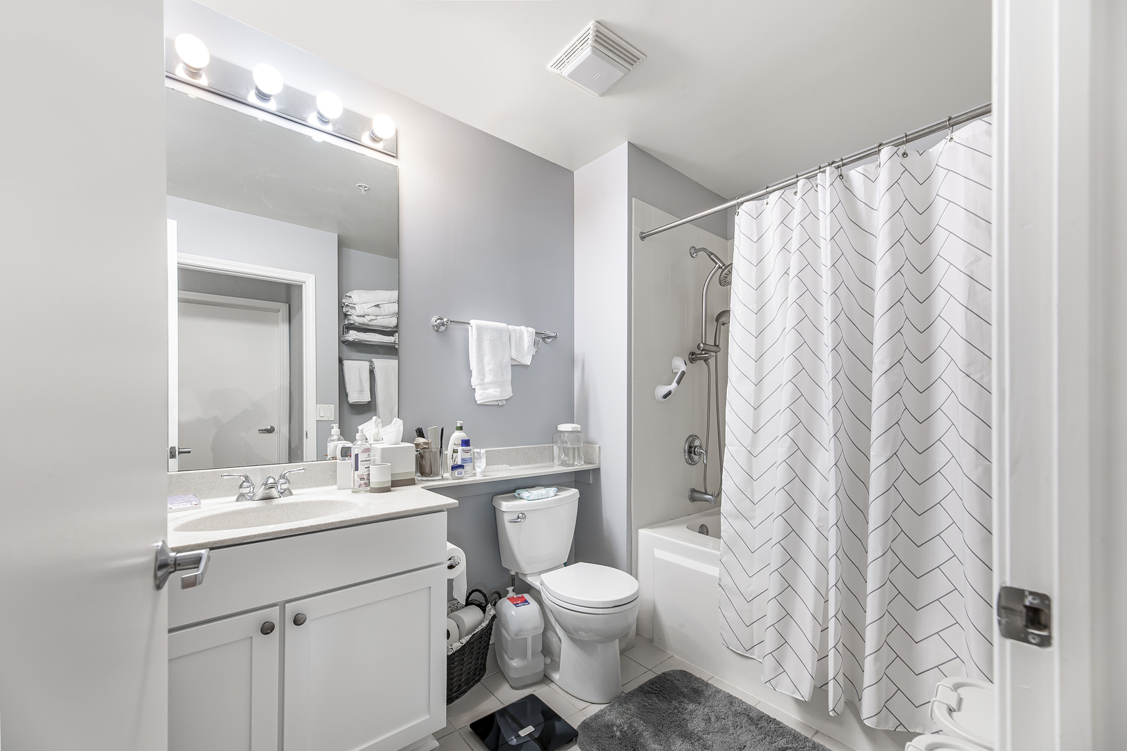1235 South Prairie Avenue, Unit 706 Chicago, IL 60605 - Photo 9 of 15 a bathroom with a double vanity sink toilet and shower