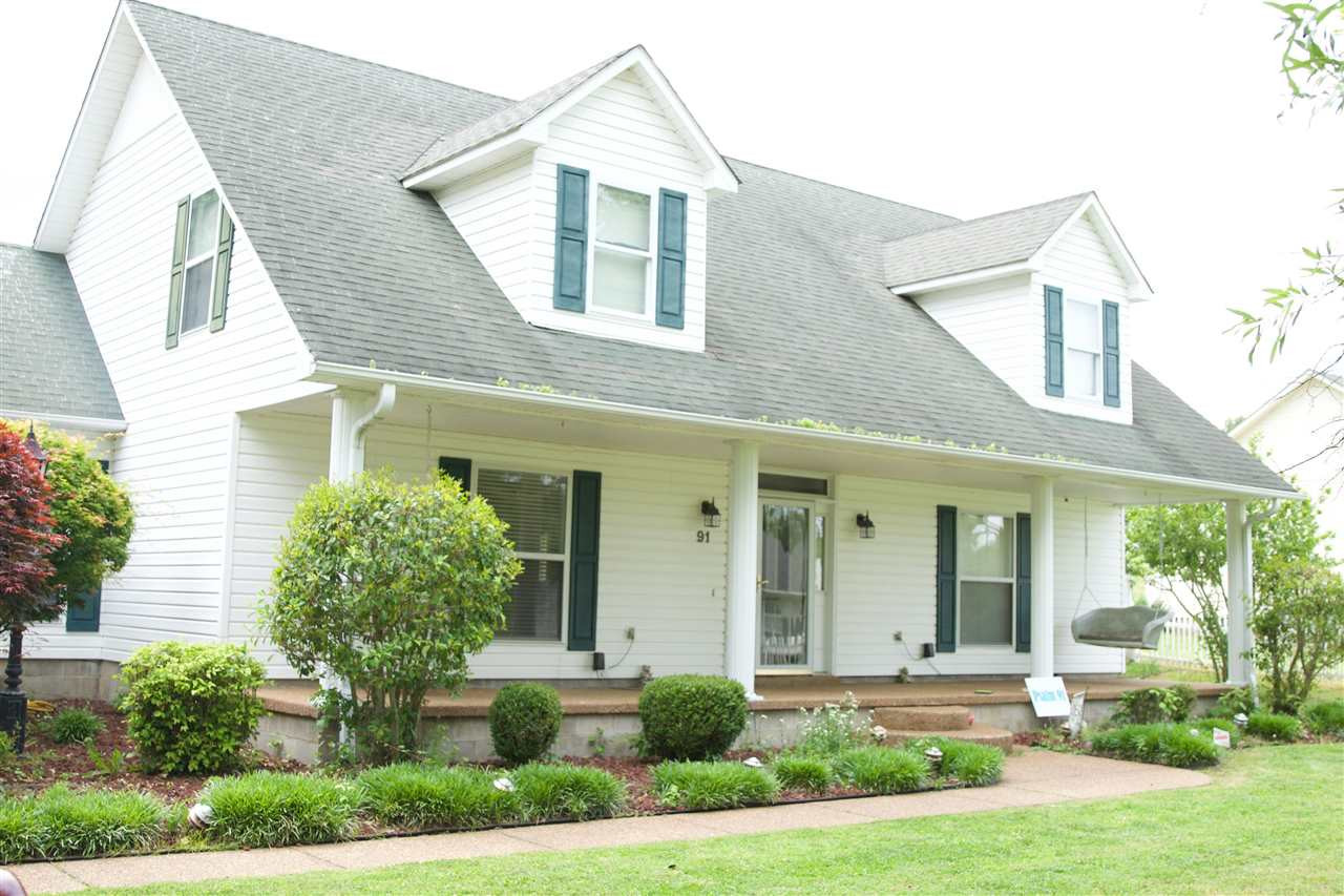 91 Collins Street Ripley, TN 38063 - Photo 1 of 18 a front view of a house with garden