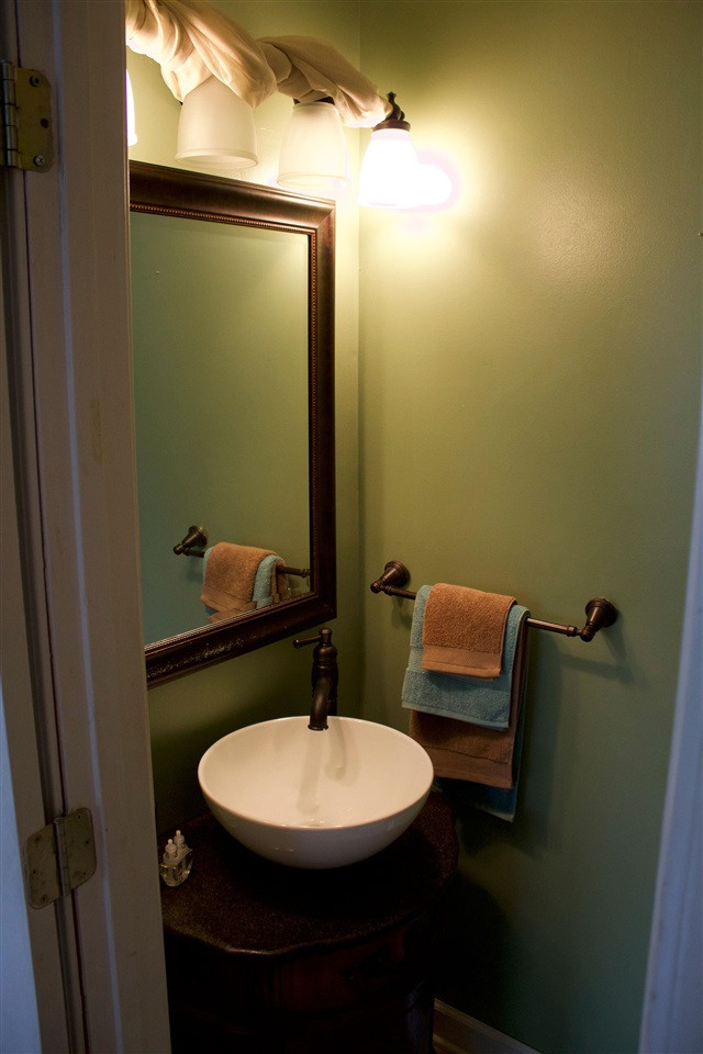 91 Collins Street Ripley, TN 38063 - Photo 16 of 18 a bathroom with a sink and a mirror