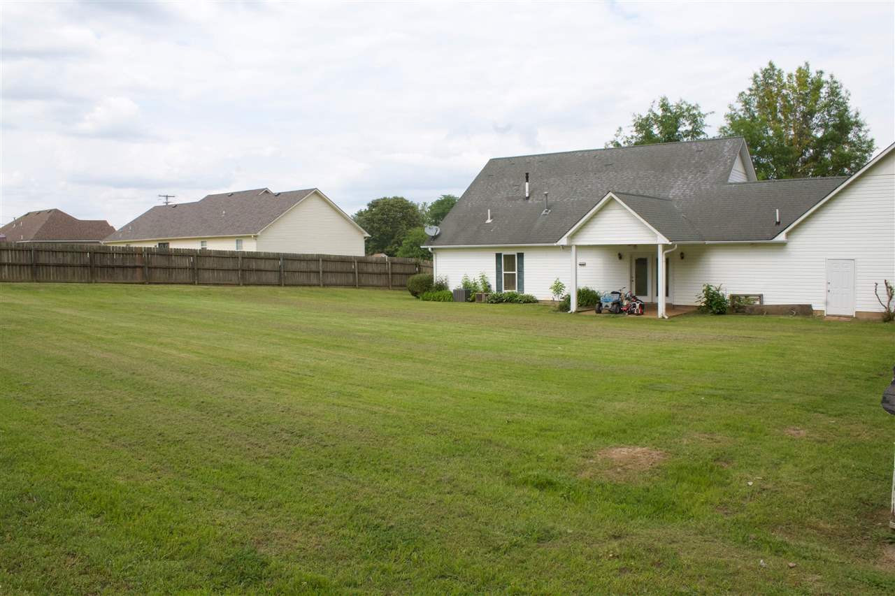 91 Collins Street Ripley, TN 38063 - Photo 18 of 18 a big house with a big yard and more large trees