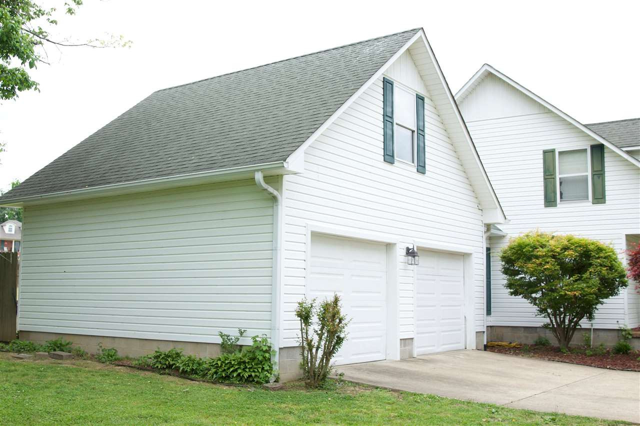 91 Collins Street Ripley, TN 38063 - Photo 2 of 18 a view of a house with a backyard
