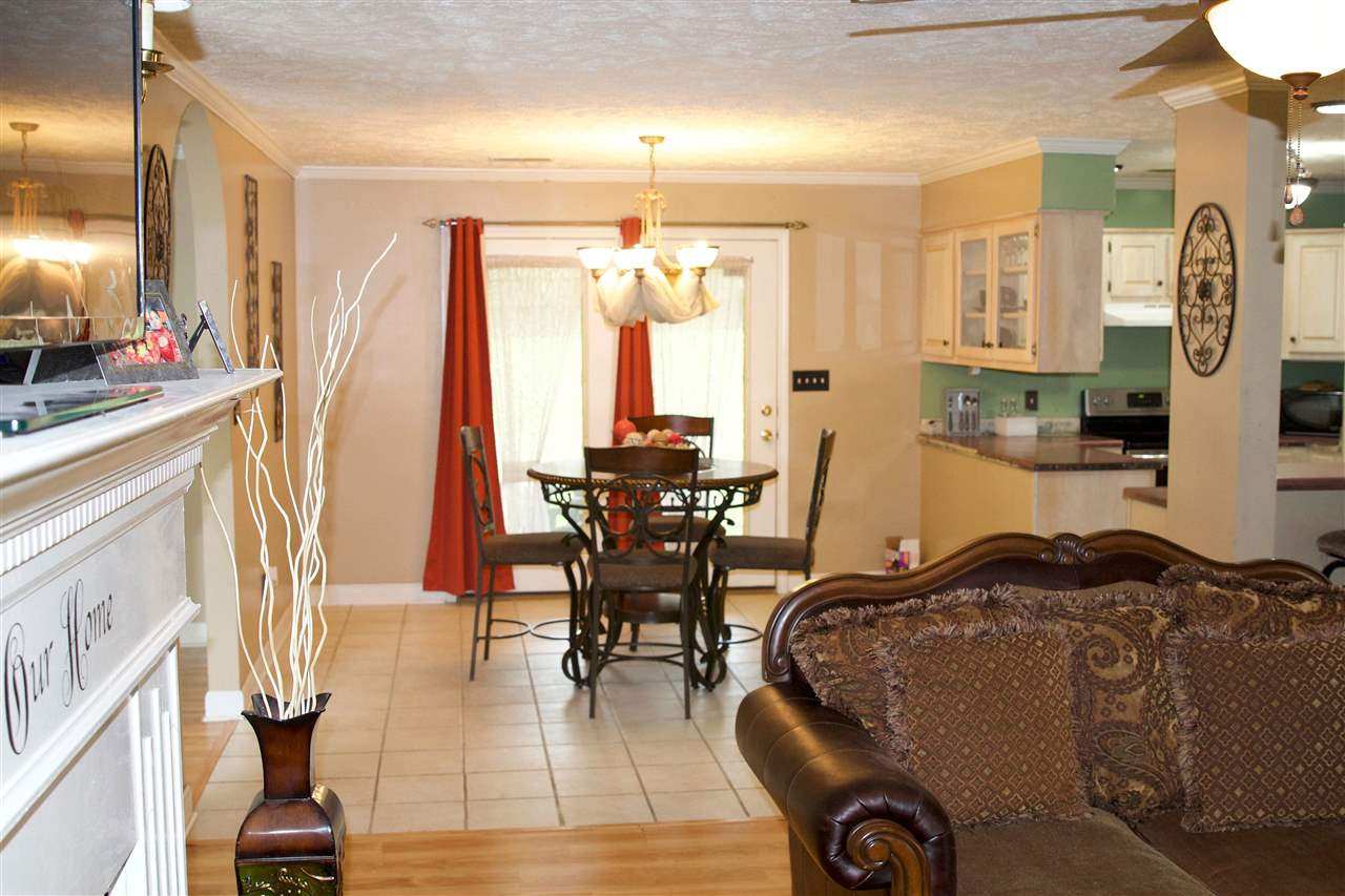 91 Collins Street Ripley, TN 38063 - Photo 5 of 18 a view of a livingroom with furniture window and wooden floor