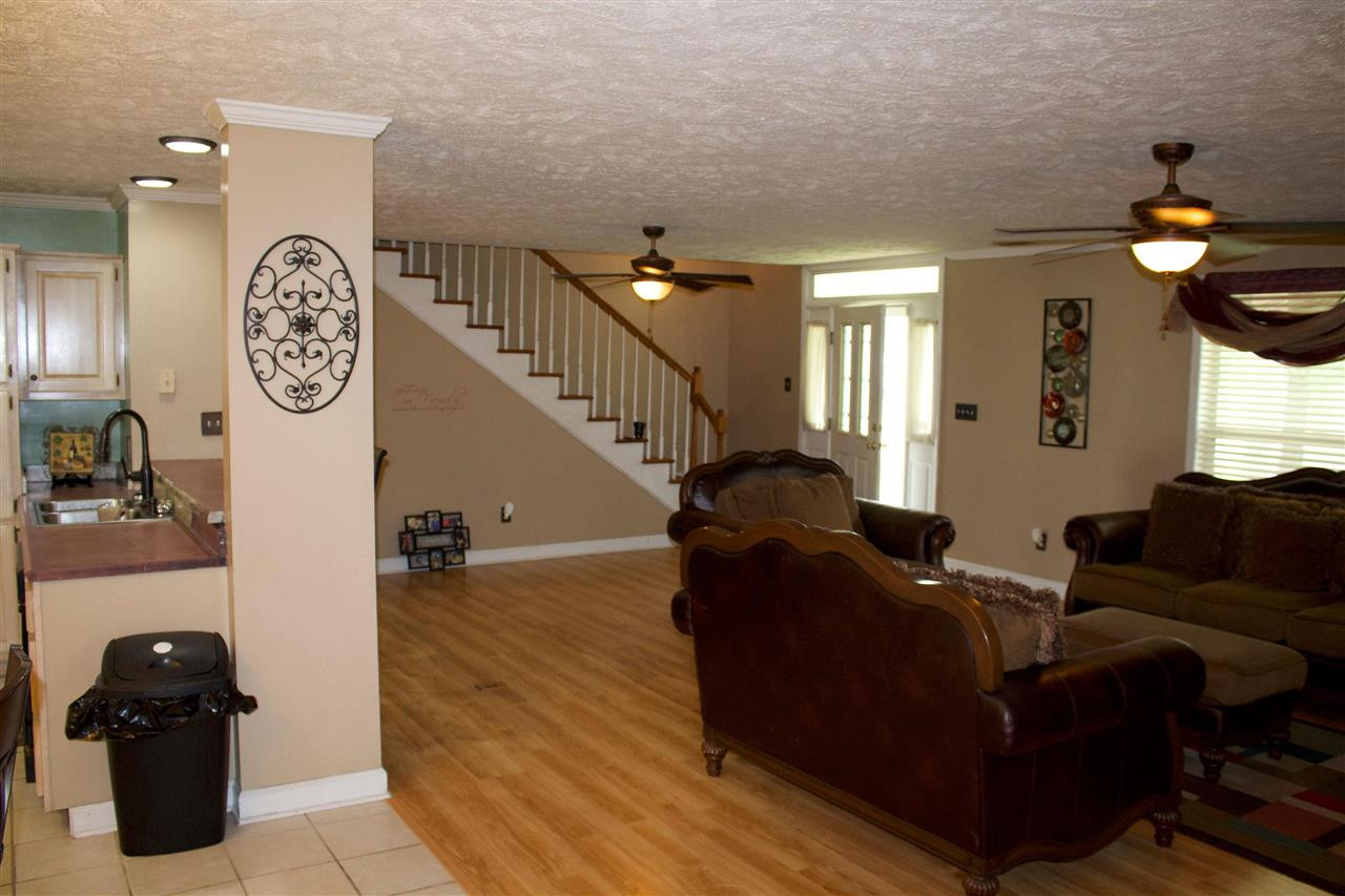 91 Collins Street Ripley, TN 38063 - Photo 6 of 18 a living room with furniture and a clock
