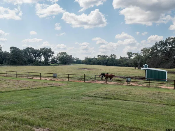 a view of a lake with houses in the back