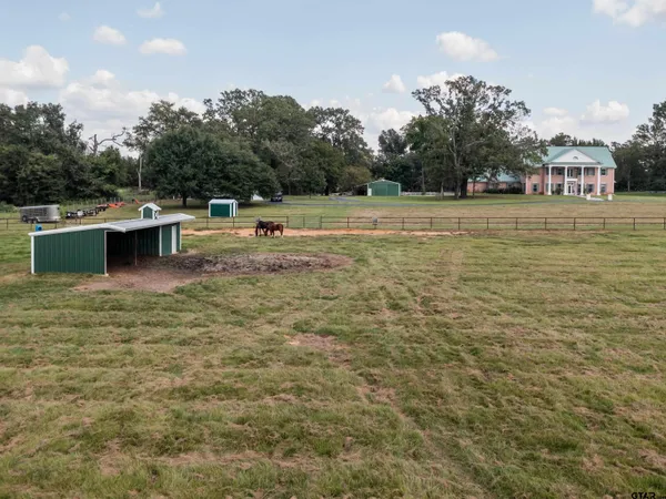 a view of a swimming pool with a yard