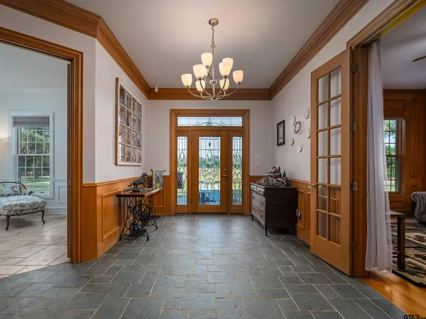 a view of a hallway with wooden shelves