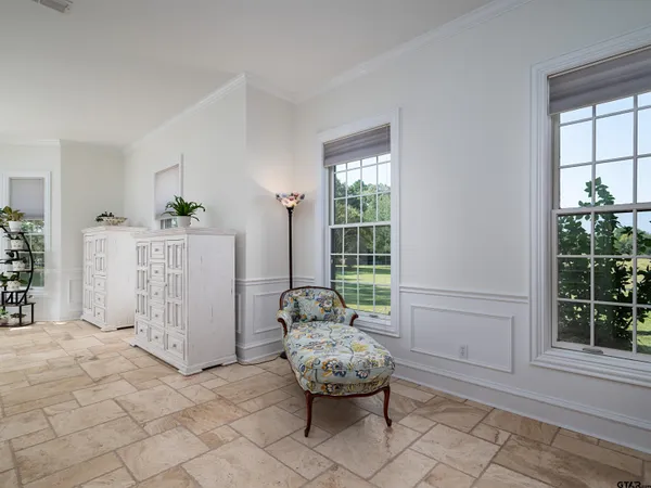 a bed room with furniture and a lamp