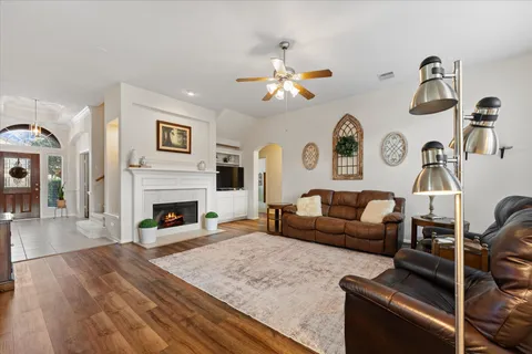 a living room with furniture and a fireplace