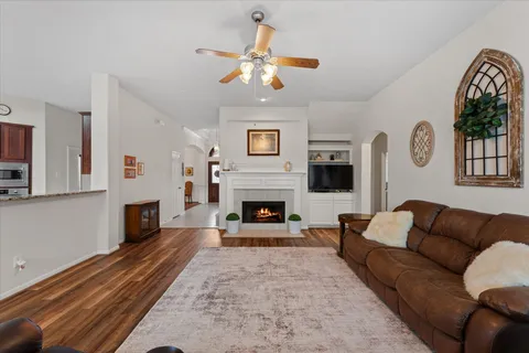 a living room with furniture and a fireplace