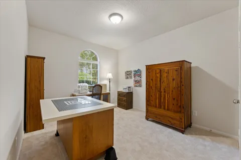 a workspace with furniture and window