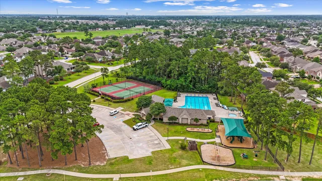 an aerial view of residential houses with outdoor space