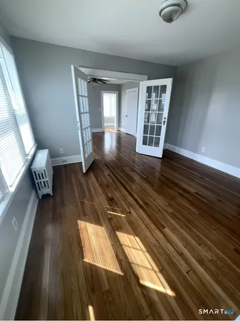 a view of entryway with wooden floor