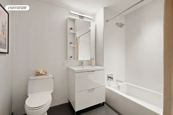 a bathroom with a toilet a sink and bathtub