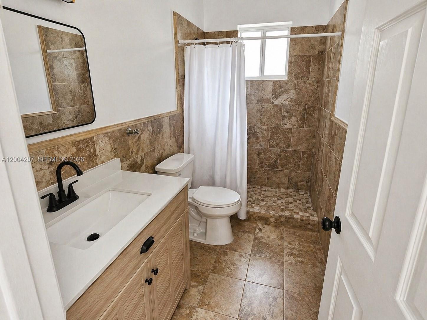 426 Southwest 26th Road Miami, FL 33129 - Photo 4 of 9 a bathroom with a sink toilet and shower