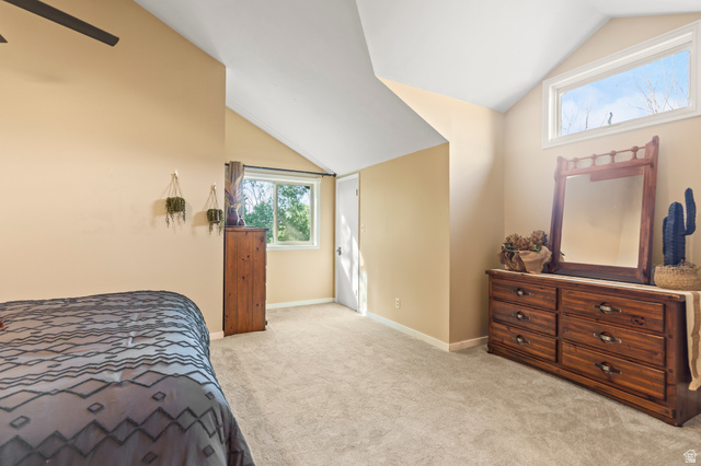 460 Omni Point Road Central Valley, UT 84754 - Photo 63 of 101 Carpeted room featuring a sloped ceiling and multiple windows providing ample natural light