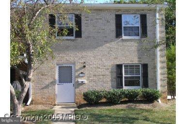 9170 Hitching Post Lane, Unit F Laurel, MD 20723 - Photo 1 of 1 a front view of a house with garden