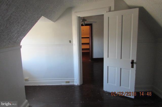 200 Woodlawn Road Baltimore, MD 21210 - Photo 22 of 26 wooden floor in an empty room