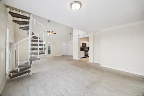 wooden floor in an empty room with a fireplace