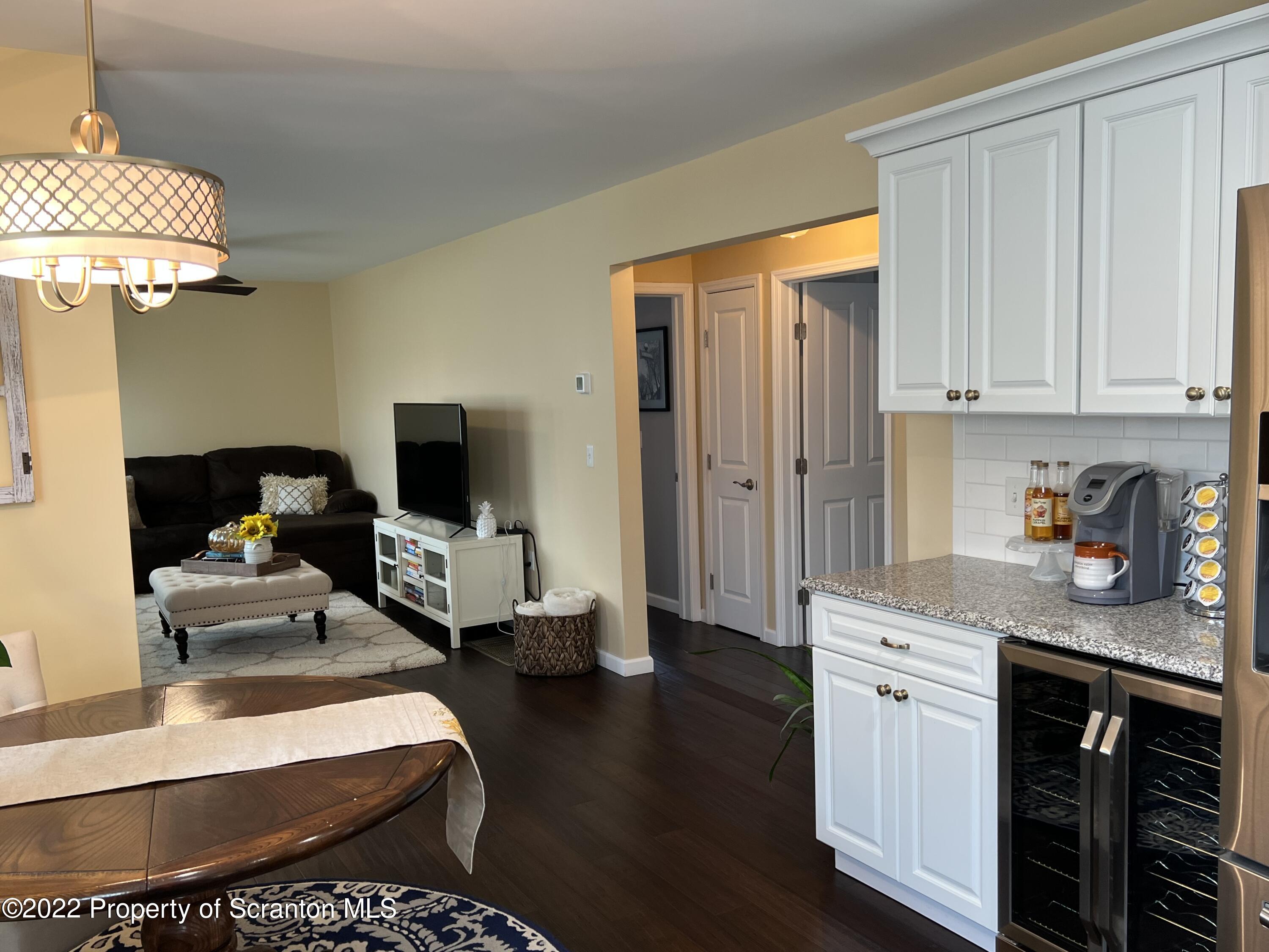 261 Main Street Eynon, PA 18403 - Photo 14 of 29 a kitchen with stainless steel appliances kitchen island granite countertop a sink dishwasher stove and cabinets