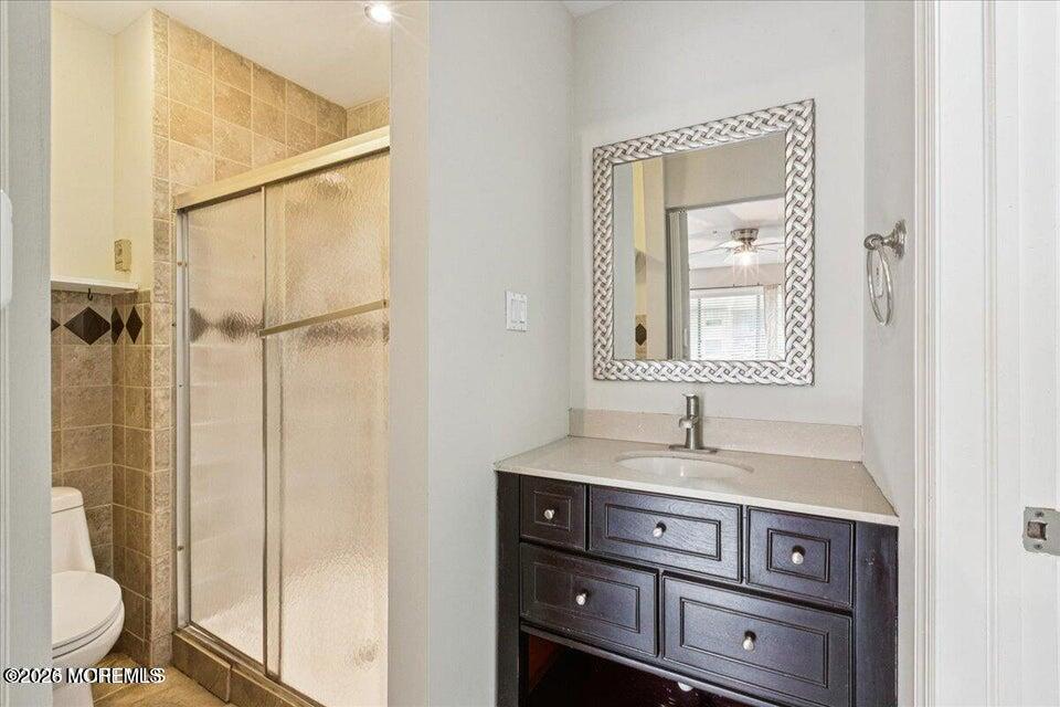 70 Overlook Way, Unit E Manalapan, NJ 07726 - Photo 12 of 20 a bathroom with a sink and a mirror