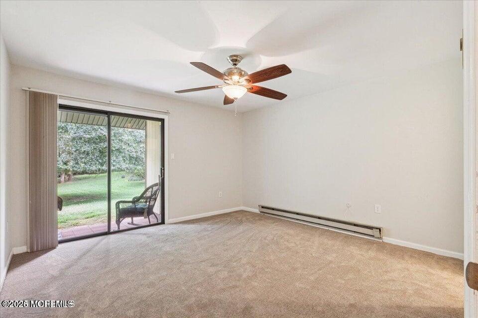 70 Overlook Way, Unit E Manalapan, NJ 07726 - Photo 14 of 20 an empty room with a window