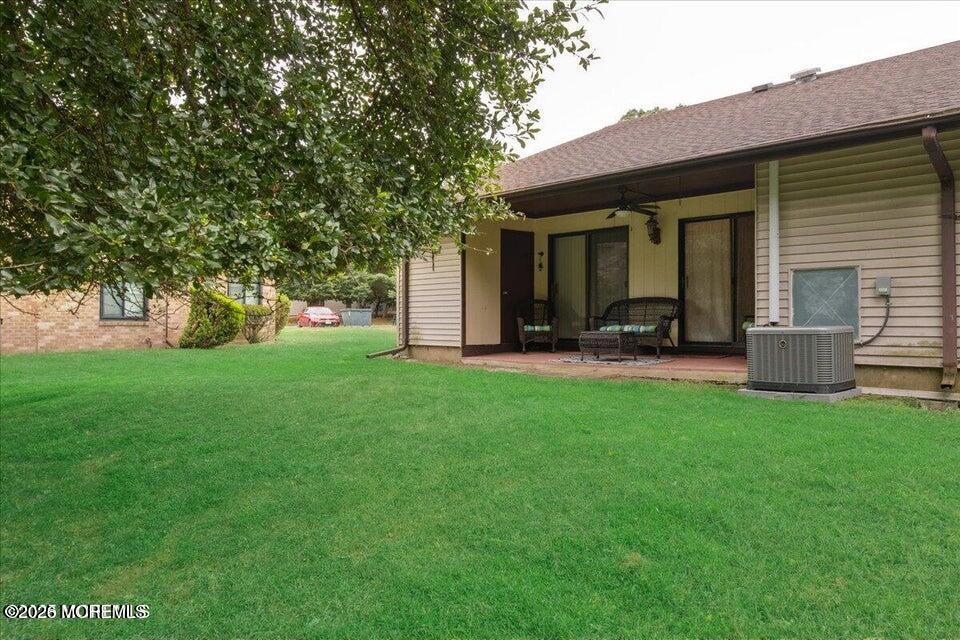 70 Overlook Way, Unit E Manalapan, NJ 07726 - Photo 18 of 20 a front view of house with yard
