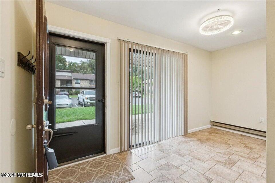 70 Overlook Way, Unit E Manalapan, NJ 07726 - Photo 8 of 20 a view of a room with a large window