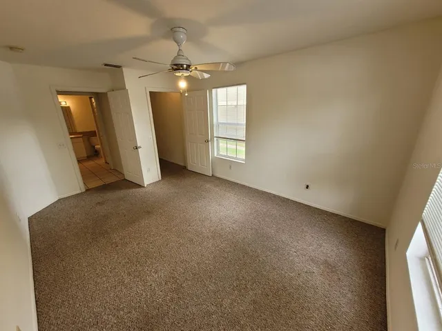 an empty room with a bathroom