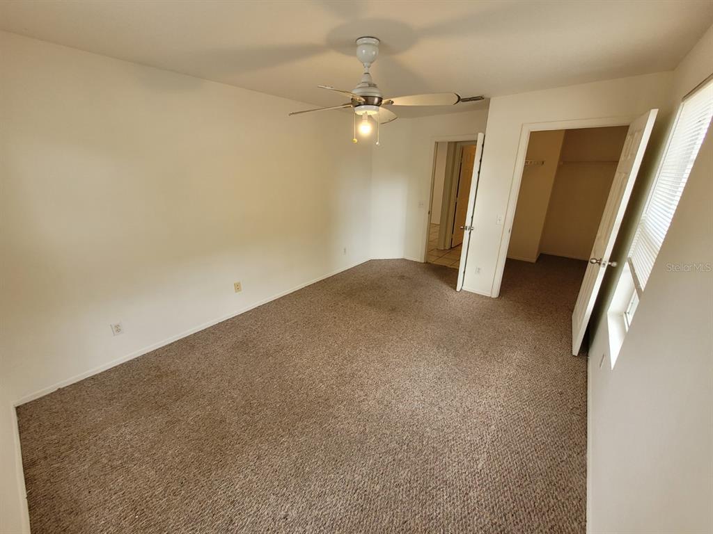 36037 Deer Creek Drive, Unit 102 Zephyrhills, FL 33541 - Photo 24 of 44 an empty room with a bathroom