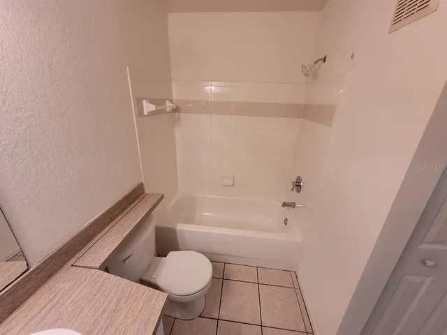 a bathroom with a toilet and a sink