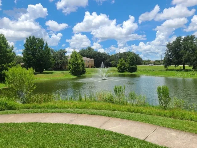 a view of a lake with a big yard