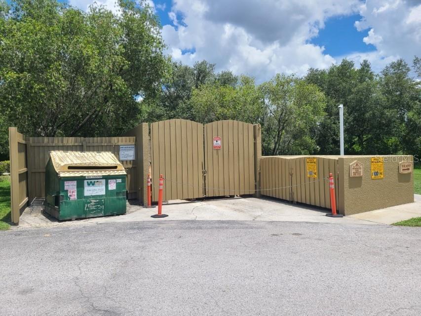 36037 Deer Creek Drive, Unit 102 Zephyrhills, FL 33541 - Photo 44 of 44 a view of backyard and tree