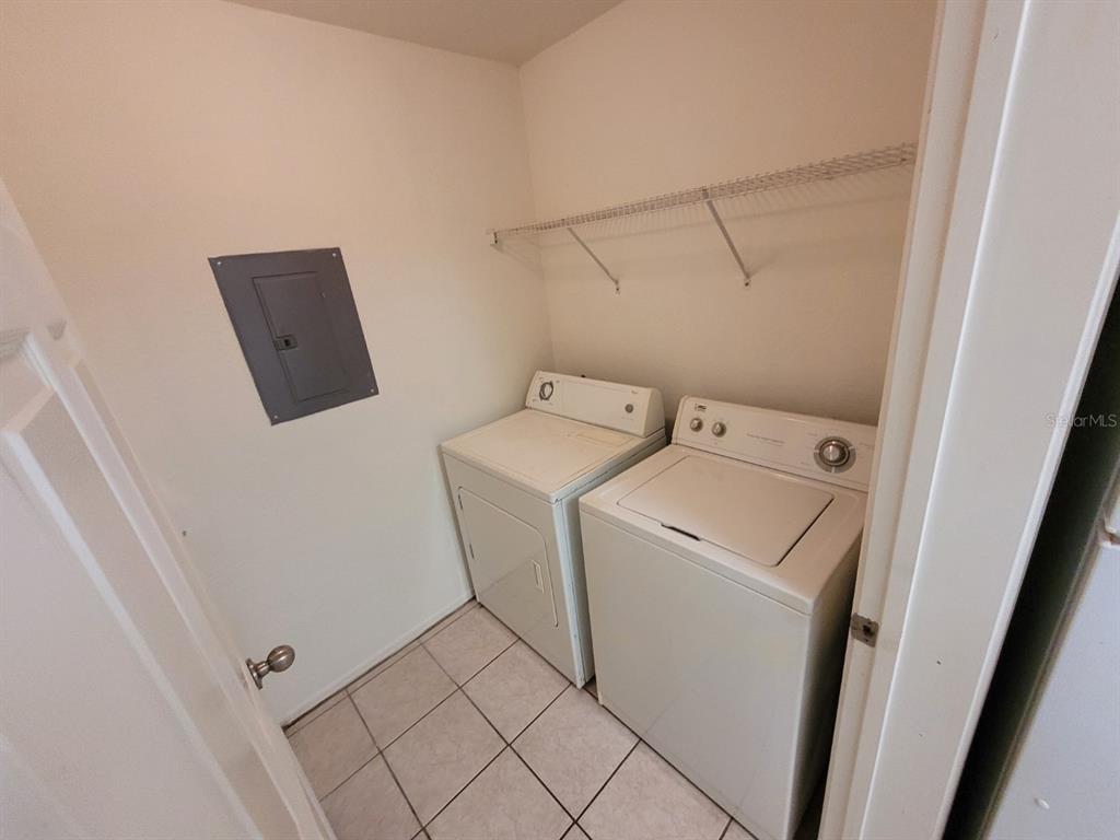 36037 Deer Creek Drive, Unit 102 Zephyrhills, FL 33541 - Photo 10 of 44 a utility room with dryer and washer