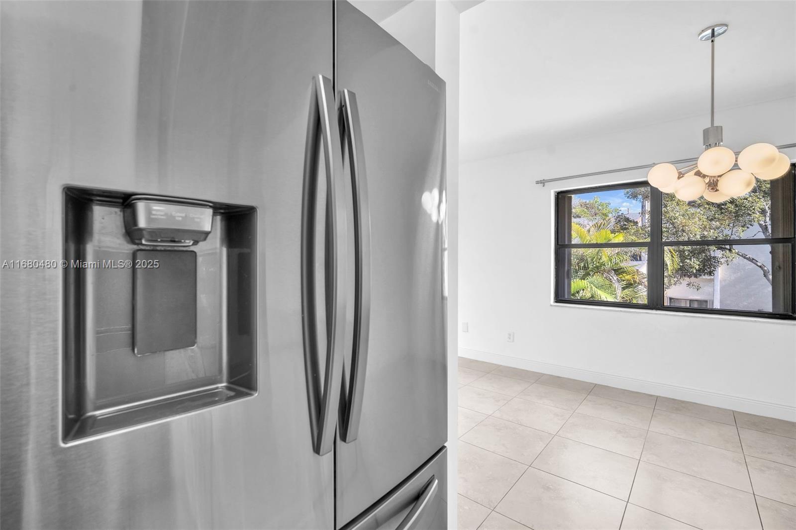 11533 Southwest 109th Road, Unit 21G Miami, FL 33176 - Photo 16 of 39 a view of a refrigerator in kitchen and window